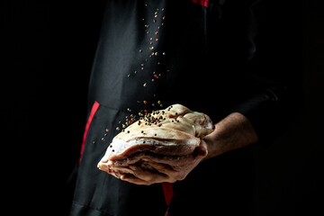 chef hands preparing pork knuckle. Oktoberfest, traditional German cuisine. banner, catering menu recipe place for text