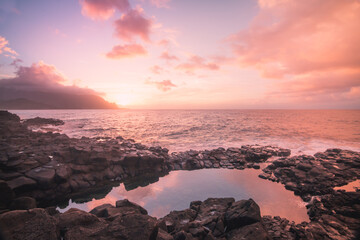 Sunset over the ocean and Queens Bath Kauai