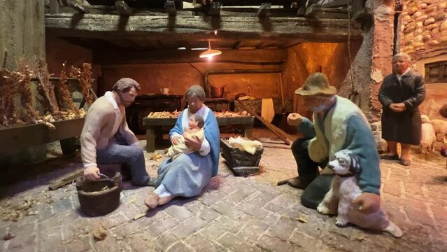 Christmas religious scene with modern nativity painted figurines. Zoom in