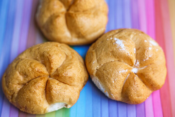 Kaiser rolls on color background