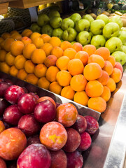 Apricot and fresh plum in the supermarket. Vegetables and fruits exposed for consumer choice. Brazilian hortifrutti