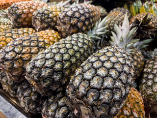 Fresh pineapple in the supermarket. Vegetables and fruits exposed for consumer choice. Brazilian hortifrutti