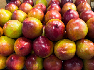 Fresh nectarines in the supermarket. Vegetables and fruits exposed for consumer choice. Brazilian...