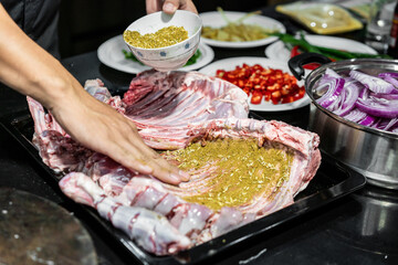 Process of pickling fresh lamb ribs.