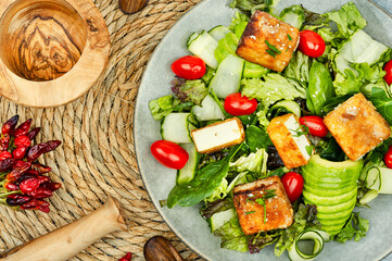Salad of roasted tofu and fresh vegetables.