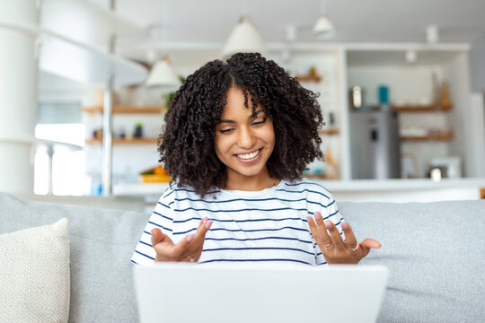 Young Woman Waving At Laptop And Talking To Her Friends Via Video Call, Woman Student Talking By Video Conference Call, Female Teacher Trainer Tutoring By Webcam, Online Training, E-coaching Concept