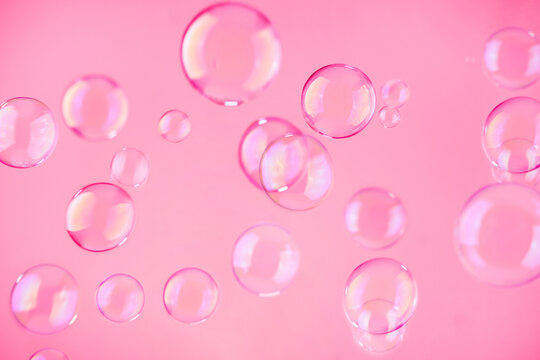 Abstract beautiful viva magenta soap bubbles background. Pink soap bubbles wallpaper.