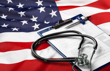 Medicare papers and USA flag on the desk.