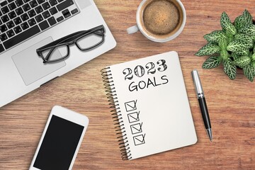 2023 goals text on paper on office desk