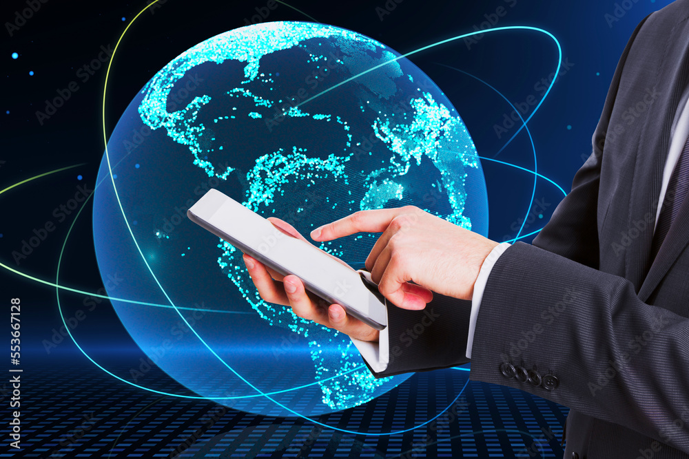 Poster close up of businessman hand holding pointing at mobile phone with creative glowing globe hologram o