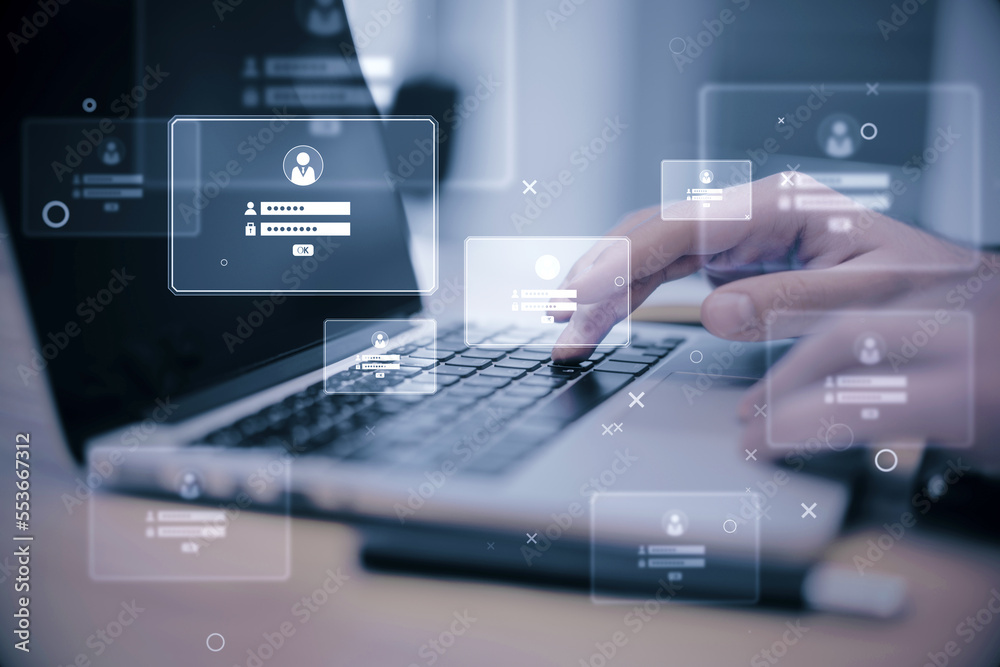 Poster close up of male hands at desktop using laptop computer monitors and login details holograms on blur