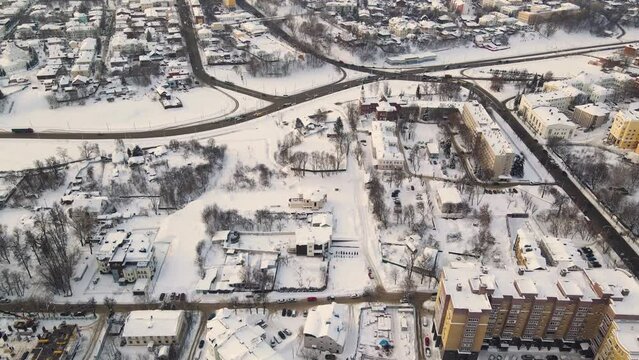 Aerial view of snowy urban residential area in winter. New buildings in a modern metropolis. Solution of the housing problem. City of Vladimir, Oktyabrsky district. UHD 4K.