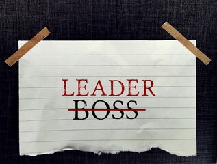 Stick note on background with text BOSS become LEADER, means different mindset of Boss (manages employees) and Leader (motivates to reach their goals)