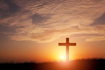 Hill with wooden cross on sunset background