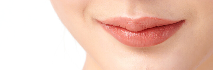 Close-up perfect natural lip makeup beautiful female mouth. Plump sexy full lips. on white background, Perfect clean skin, fresh lip make-up. Beautiful spa tender lips. Blank Space