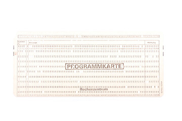 vintage punched programming paper card for computer programming and data storage isolated on white background 