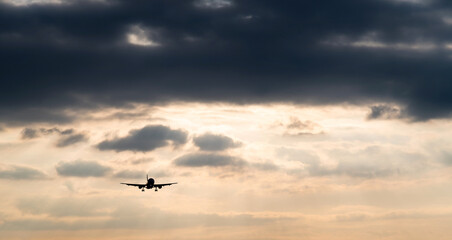 Airplane flying in overcast sky