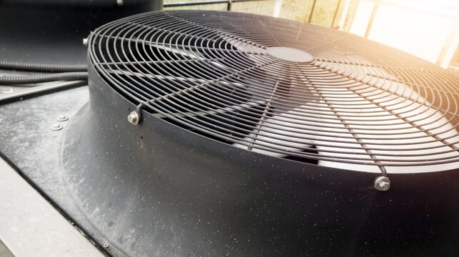 The Close up View of Metal Ventilation Fan not rotating with the shine light.
