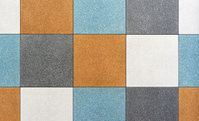 Fototapeta premium Multi-colored square ceramic tiles for the floor of the kitchen or bathroom.