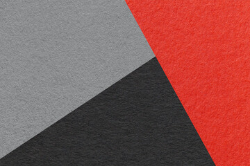 Texture of craft red, black and gray shade color paper background, macro. Structure of vintage...