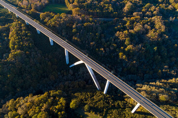 Fototapeta premium aerial view of a high speed train viaduct at sunset