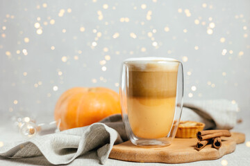 Pumpkin spicy latte on a gray background.