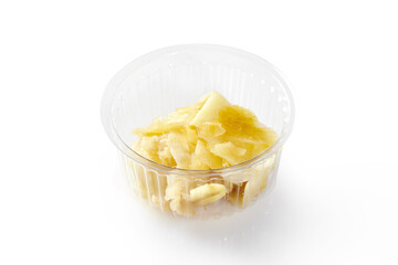 Plastic bowl of pickled ginger, traditional Japanese sushi accompaniment