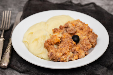 Minced meat and mashed potato on white plate