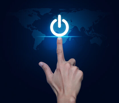 Hand pressing power button icon over digital world map technology style, Start up business concept, Elements of this image furnished by NASA
