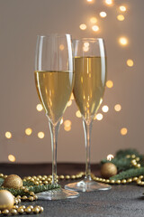 New year's eve, glasses of champagne on black table, Cristmas decoration background