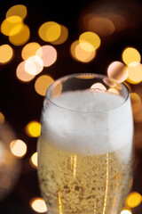 New year's eve, glass of champagne on black table, Cristmas decoration background