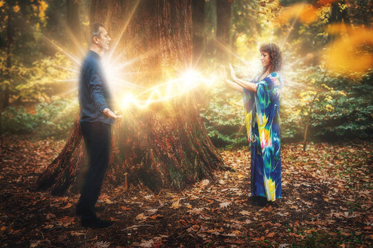 Man and woman heal each other with healing energy. Pranic healing.