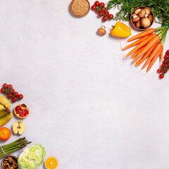 Square frame, border with raw fresh vegetables and fruits on table, copy space