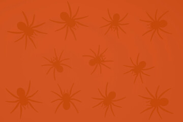 Black spiders on an orange background, gradient background and silhouettes of spiders, festive scary background, frightening decoration for Halloween, paper crafts gifts, material for needlework