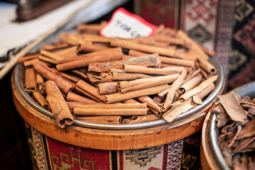 Cinnamon sticks on an outdoor market stall in the city of Gaziantep of Turkey country, close up
