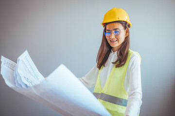 Beautiful young asian woman engineer and safety helmet on white background, construction concept, Engineer, Industry. Female entrepreneur determined to win.