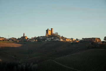 the castle of serralunga d'alba in the Piedmontese langhe, during the autumn season with the colors...