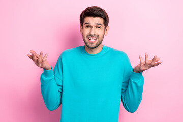 Photo portrait of nice young guy shrug shoulders confused shocked wear trendy blue garment isolated...