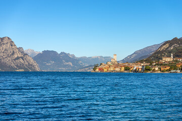 Fototapeta premium Malcesine village. Famous tourist resort on the coast of Lake Garda (Lago di Garda) with the castle. Verona province, Italy, Veneto, southern Europe. On background the mountain range of Italian Alps.