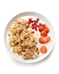 bowl of sweet cereal and red fruit with milk, isolated on white background, top view