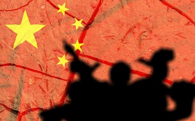 Red China flag on wall and human silhouette