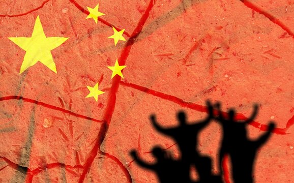 Red China flag on wall and human silhouette