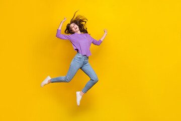 Fototapeta na wymiar Full length photo of crazy satisfied person jumping empty space ad isolated on yellow color background