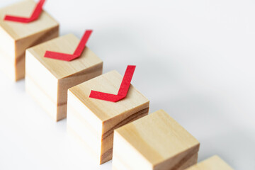 Check concept list checked on wooden block