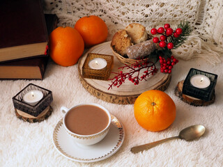 Cup of coffee, mantecados and polvorones, oranges