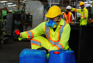 worker wearing uniform protection chemicals.Industrial worker holding plastic bottle with chemicals...