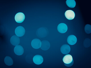 Dark blue round bokeh background copy space