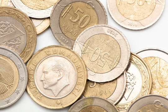 Turkish lira coins as a background.