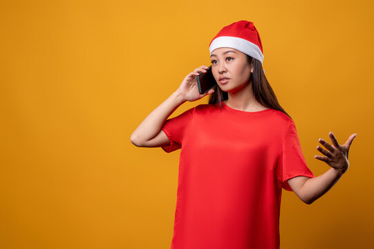 Young woman in red speaking on the phone