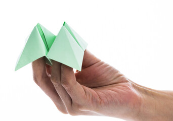 People hand holding a origami fortune on white background
